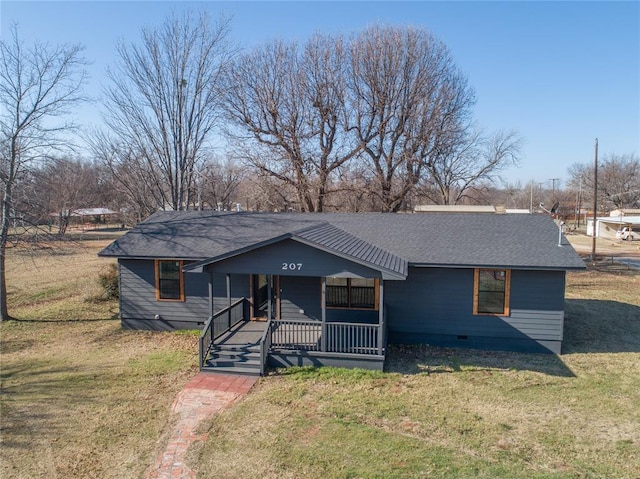 view of front of home with covered porch and a front yard