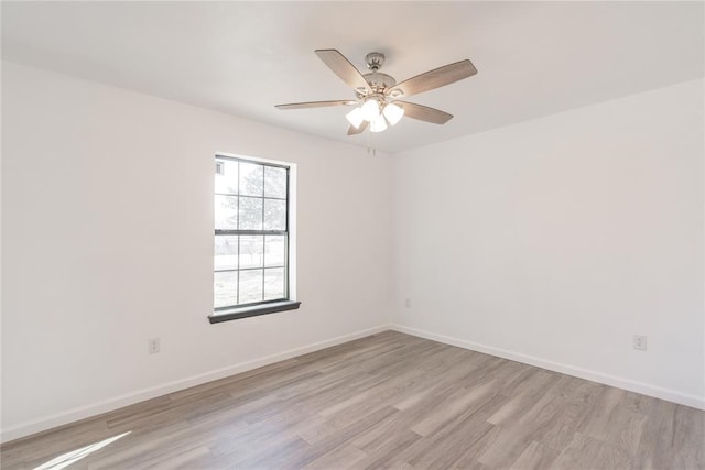 unfurnished room with light hardwood / wood-style flooring and ceiling fan