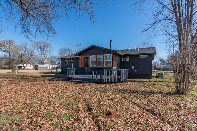 rear view of property featuring a deck and central air condition unit