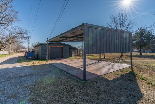 exterior space featuring a garage and an outdoor structure