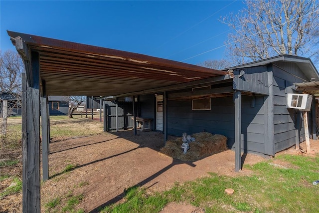 view of side of home featuring an outdoor structure