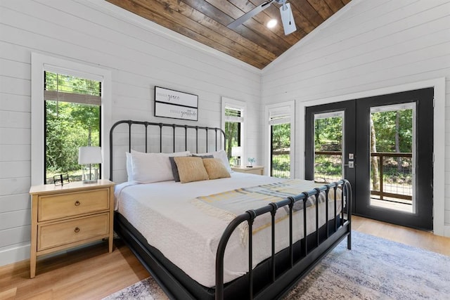 bedroom with access to exterior, vaulted ceiling, ceiling fan, light hardwood / wood-style flooring, and wooden ceiling