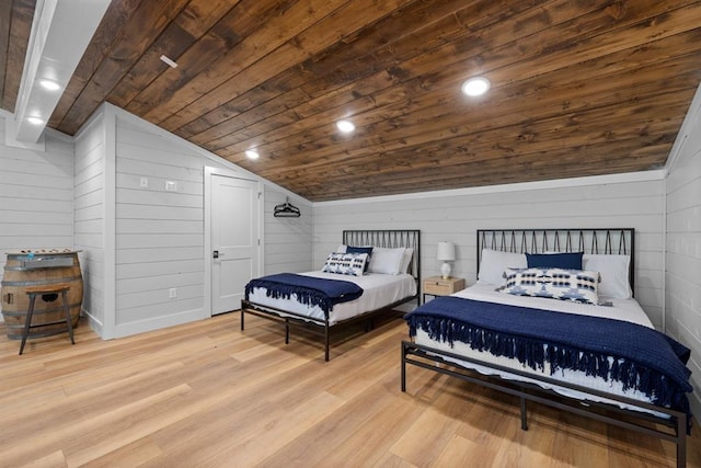 bedroom featuring light hardwood / wood-style flooring, vaulted ceiling, wooden walls, and wood ceiling