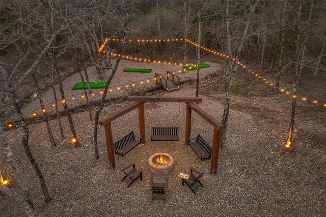 view of yard featuring a fire pit