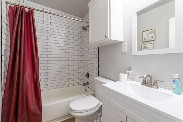 full bathroom featuring shower / tub combo with curtain, vanity, and toilet