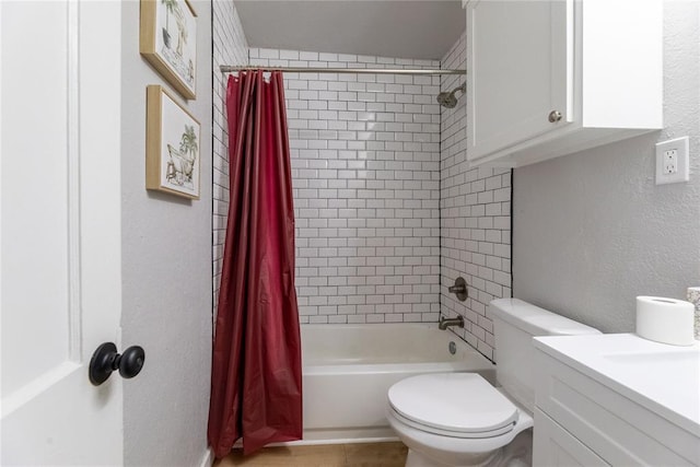 full bathroom with vanity, shower / tub combo with curtain, and toilet