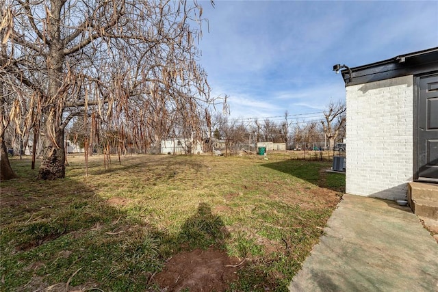 view of yard with central AC unit