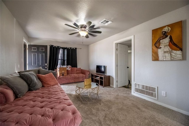 carpeted living room featuring ceiling fan