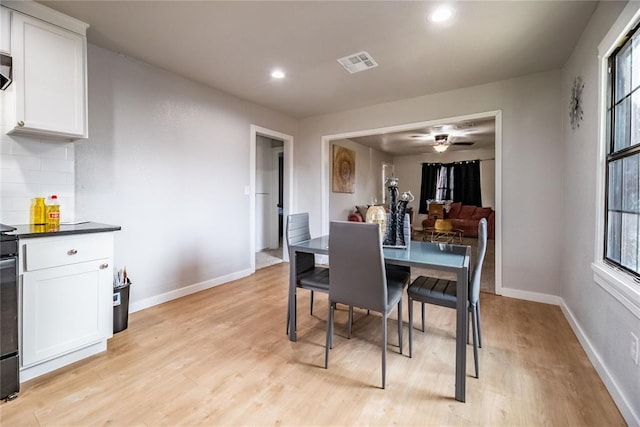 dining room featuring ceiling fan and light hardwood / wood-style floors