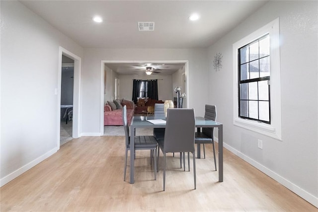 dining space with light wood-type flooring