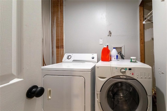 laundry room featuring washing machine and clothes dryer