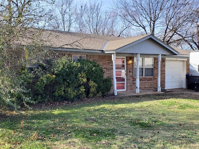 ranch-style house with a garage, a shingled roof, a front lawn, and brick siding