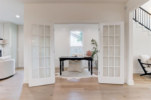 doorway featuring light hardwood / wood-style floors and french doors