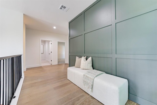 sitting room featuring light wood-type flooring