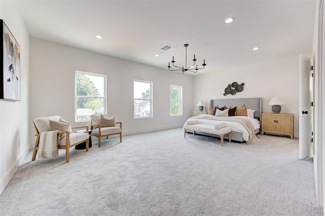 carpeted bedroom featuring a chandelier