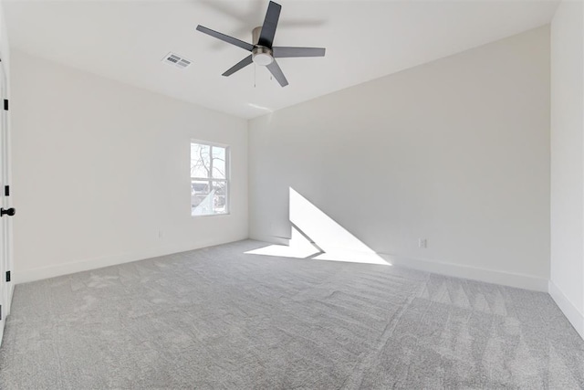 unfurnished room featuring light carpet and ceiling fan