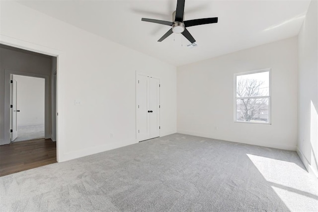 interior space featuring ceiling fan