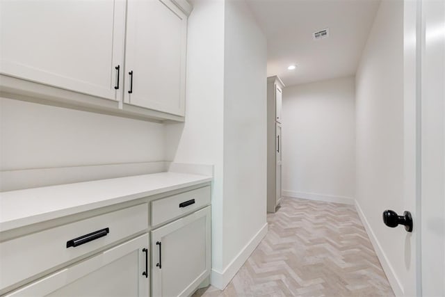 bar with white cabinetry