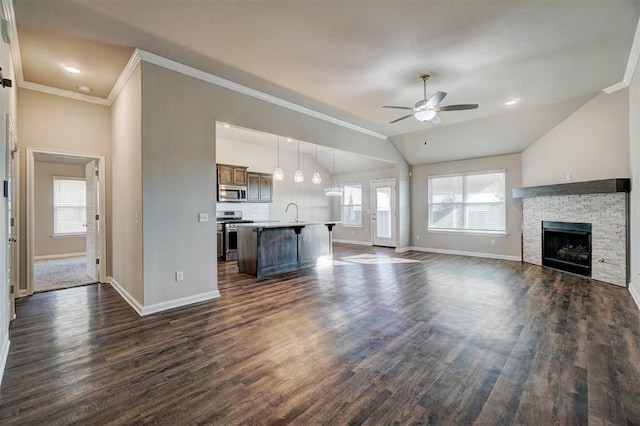 unfurnished living room featuring ceiling fan, dark wood-type flooring, and vaulted ceiling