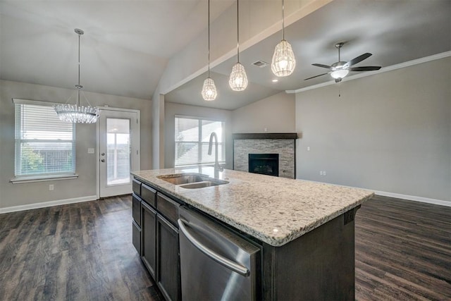 kitchen featuring dishwasher, an island with sink, hanging light fixtures, and sink