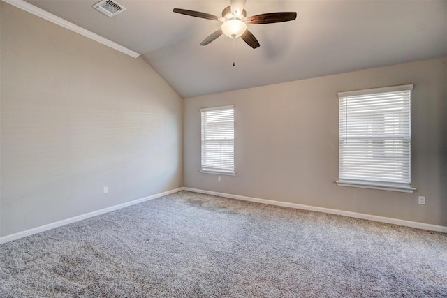 carpeted empty room with ceiling fan and lofted ceiling