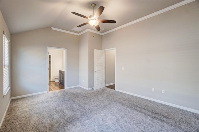 unfurnished bedroom featuring ensuite bath, ceiling fan, crown molding, lofted ceiling, and light carpet