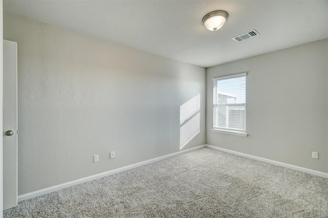 unfurnished room with carpet flooring