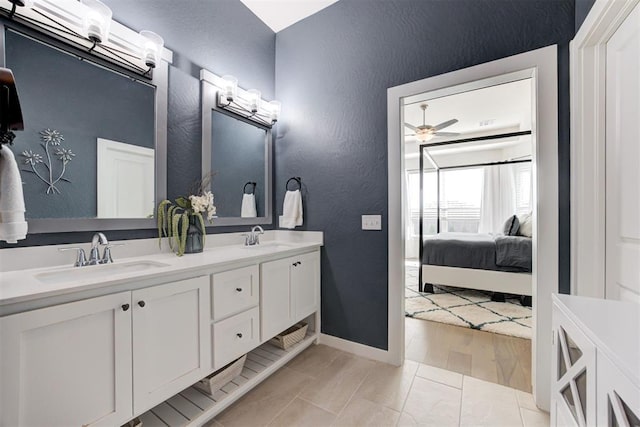 bathroom with ceiling fan, tile patterned flooring, and vanity