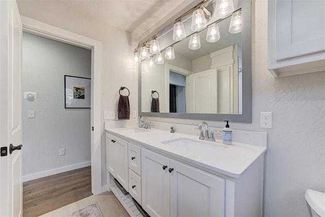 bathroom featuring vanity and wood-type flooring