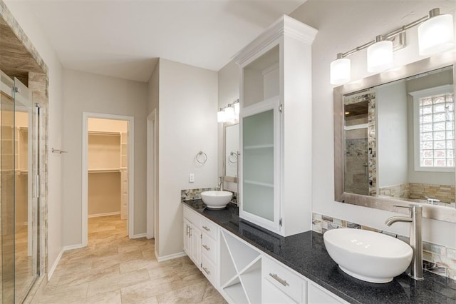 bathroom featuring vanity and an enclosed shower