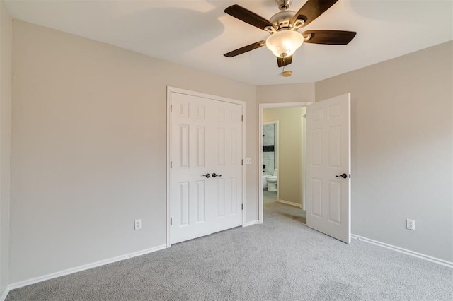 unfurnished bedroom featuring light carpet and ceiling fan