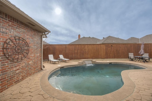 view of pool featuring a patio area and pool water feature