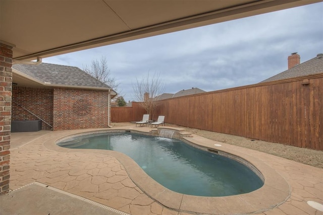 view of pool with pool water feature and a patio area