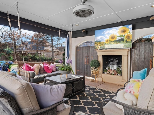 sunroom / solarium featuring a drop ceiling