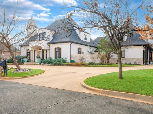 5808 Mistletoe Ct, Oklahoma City, OK 73142 - french country inspired facade featuring a front yard