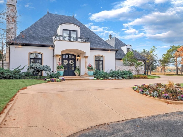 5808 Mistletoe Ct, Oklahoma City, OK 73142 - french provincial home featuring french doors and a balcony
