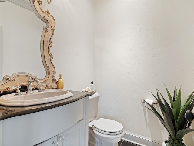 5808 Mistletoe Ct, Oklahoma City, OK 73142 - bathroom featuring tile patterned flooring, vanity, and toilet