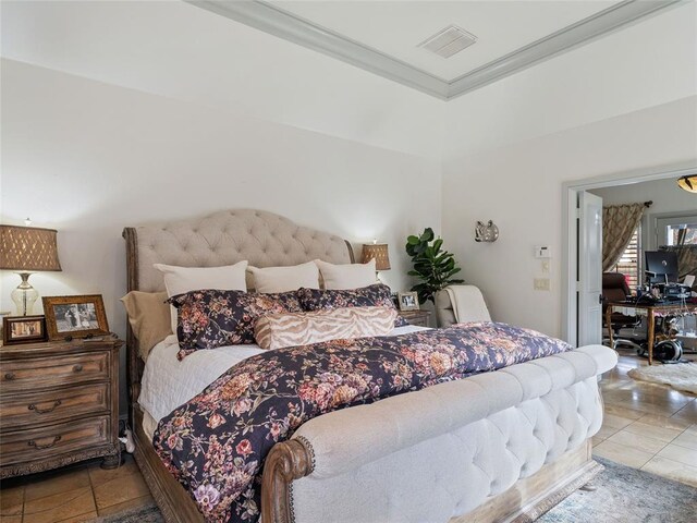 5808 Mistletoe Ct, Oklahoma City, OK 73142 - tiled bedroom with a raised ceiling and ornamental molding