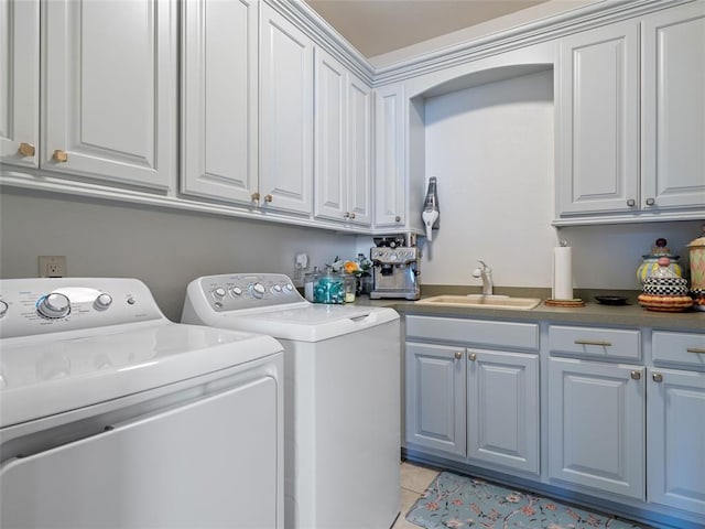 5808 Mistletoe Ct, Oklahoma City, OK 73142 - laundry area with cabinets, independent washer and dryer, light tile patterned floors, and sink