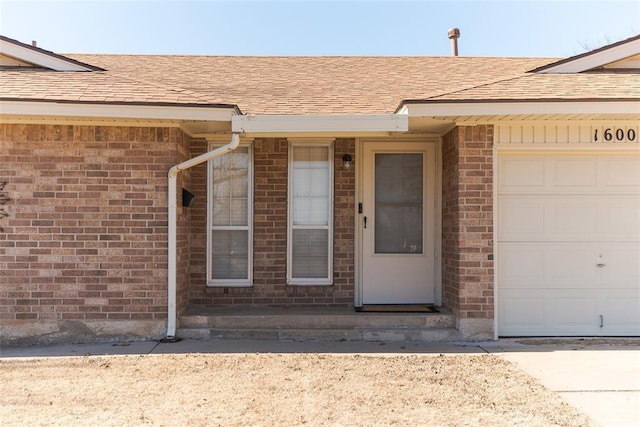 view of exterior entry featuring a garage