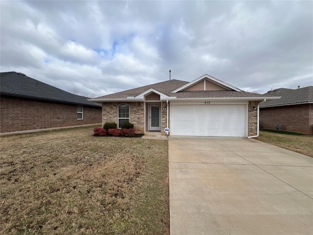 single story home featuring a front yard and a garage