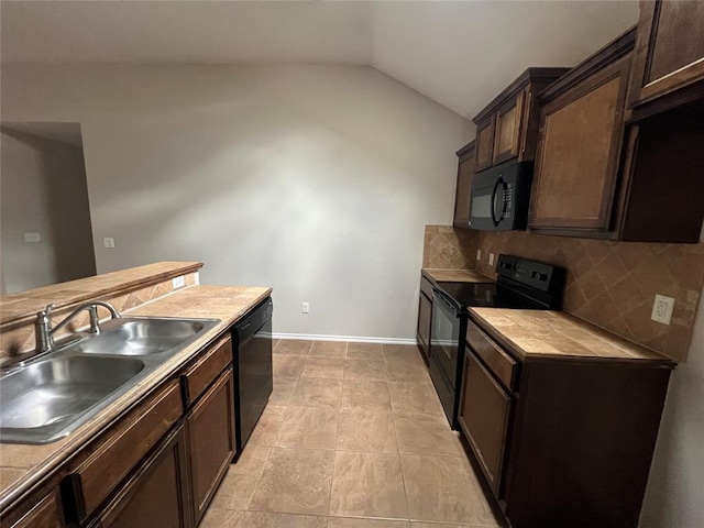 kitchen featuring backsplash, dark brown cabinetry, black appliances, and lofted ceiling