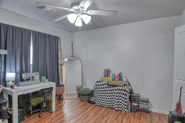 interior space with hardwood / wood-style flooring and ceiling fan