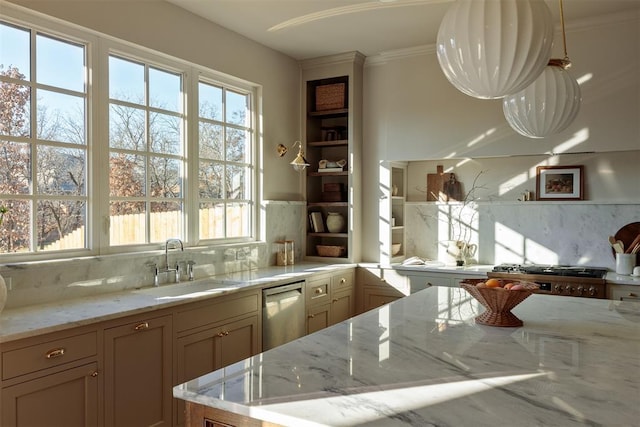 kitchen featuring decorative backsplash, light stone countertops, sink, dishwasher, and hanging light fixtures