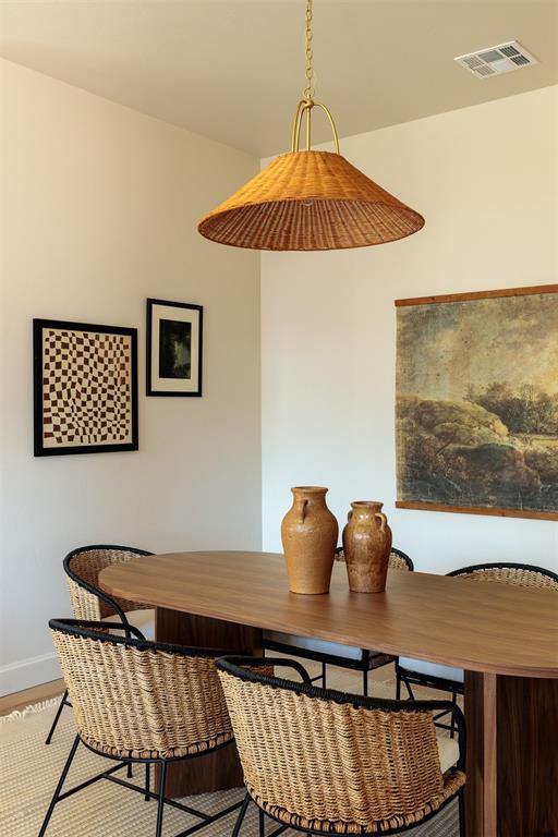 dining room with wood-type flooring