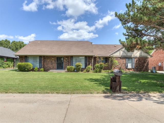 ranch-style home featuring a front yard