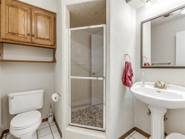 bathroom featuring walk in shower, tile patterned flooring, and toilet