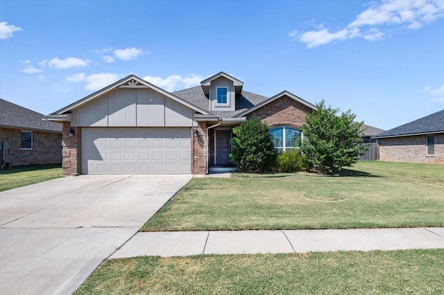 view of front of house featuring a front lawn and a garage