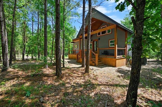 view of side of property with a wooden deck