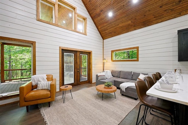 living room featuring high vaulted ceiling, wooden walls, wooden ceiling, and dark hardwood / wood-style floors